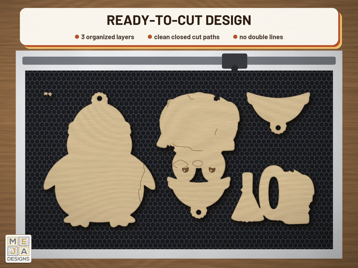 Rustic JOY Penguin Ornament laser cut file: the cut file on a laser bed
